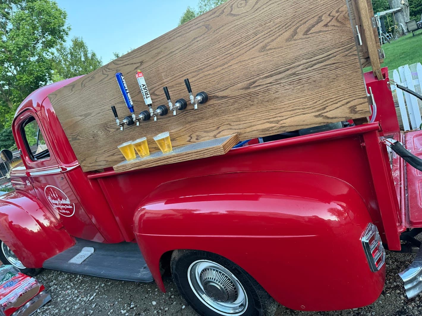 Beer taps with fresh beverages displayed at mobile bar station
