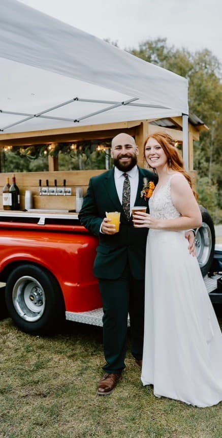Bride and groom at tap trailer
