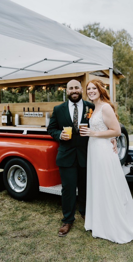 Bride and groom at tap trailer